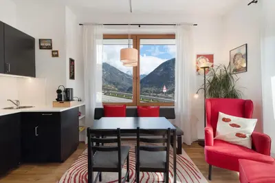 a kitchen and dining room with a table and chairs at Casa Maria Beatrice in Mühlbach