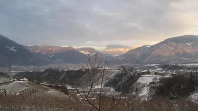 a view of a valley with mountains in the background at Gfillhof Ferienwohnung 1 in Appiano sulla Strada del Vino
