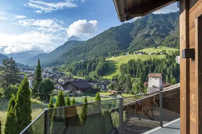 a balcony with a view of a valley at Chalet Berna in Ortisei