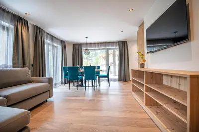 a living room with a couch and a table at Apartments LaBar in Ortisei