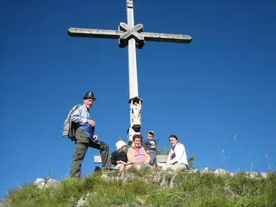 a group of people standing in front of a cross at Agriturismo Tolpei in La Valle