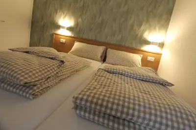two beds sitting next to each other in a bedroom at Affittacamere Mercedes in Romallo