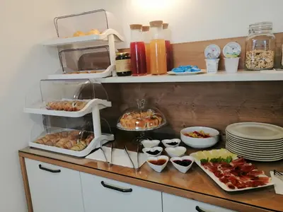 a kitchen with a counter with food on it at Affittacamere Mercedes in Romallo