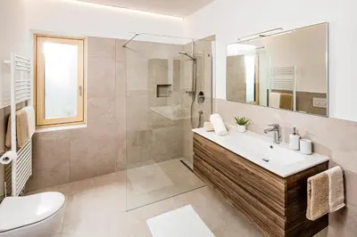 a bathroom with a sink and a shower and a toilet at Appartement Irene in Caldaro