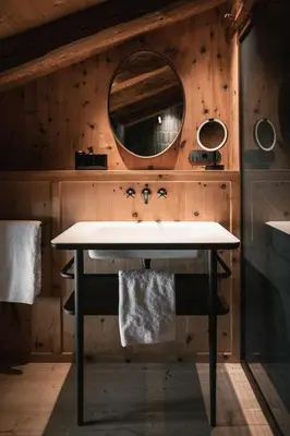 a bathroom with a sink and a mirror at Felder Alpin Lodge in Villandro