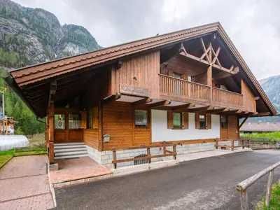 a dining room with a table and chairs at Chalet Cesa Galadriel-3 by Interhome in Penia