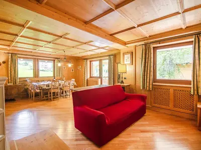 a balcony of a cabin with a view of a mountain at Chalet Cesa Galadriel-3 by Interhome in Penia