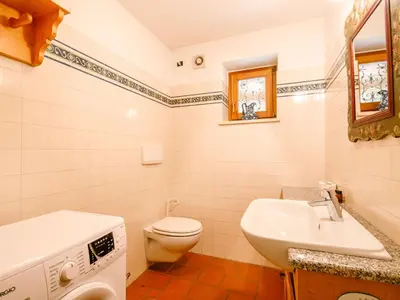 a bathroom with a sink and a toilet at Chalet Cesa Galadriel-3 by Interhome in Penia