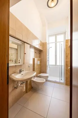 a bathroom with a sink and a toilet at Mia Rooms - Room with Private Bath Bolzano Center in Bolzano