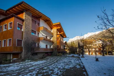 a snow covered street in front of a building at Villa Ginestra 3 in Moena