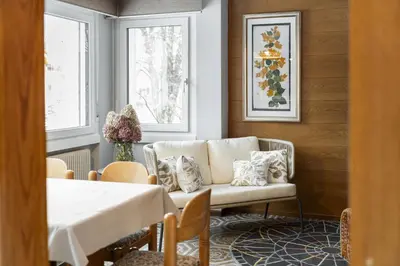 a living room with a couch and a table at Villa Ginestra 3 in Moena