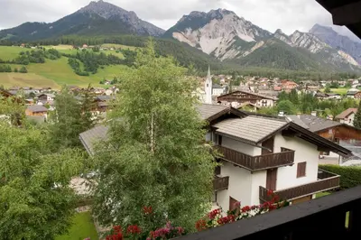 a view of a town with mountains in the background at Ciasa Torneri in San Vigilio Di Marebbe