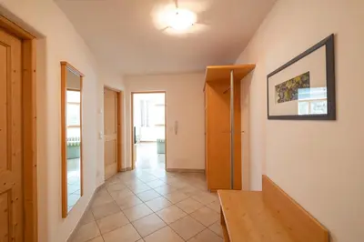 a hallway of a house with a door and a tile floor at Messnerhof, Durnholz in Valdurna