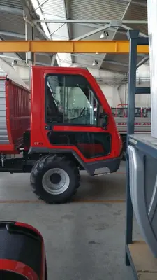 a red jeep parked in a garage at Pinterhof in San Vigilio Di Marebbe