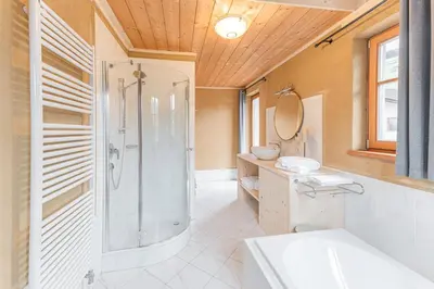 a bathroom with a shower and a sink at Eco Chalet Olival in Braies