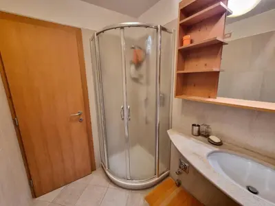 a bathroom with a shower and a sink at Col Rodella - Canazei in Canazei
