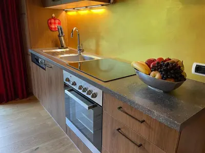 a kitchen with a bowl of fruit and a sink at Villa Anita San Vigilio di Marebbe in San Vigilio Di Marebbe