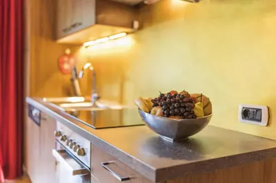 a bowl of fruit on a counter in a kitchen at Villa Anita San Vigilio di Marebbe in San Vigilio Di Marebbe