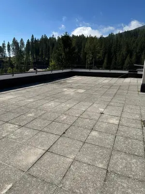 a view of a roof with mountains in the background at Case Vacanza Marco - Apt 115 in San Martino di Castrozza
