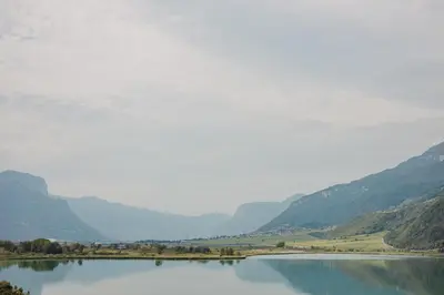 a view of a lake with mountains in the background at Residence Haus Kalterersee in Caldaro