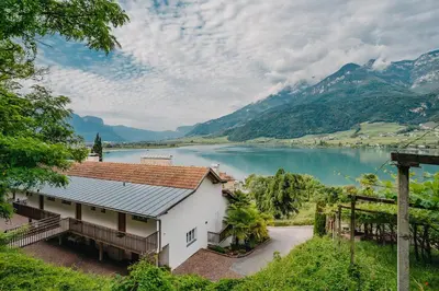 a house with a view of a lake at Residence Haus Kalterersee in Caldaro