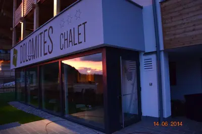 a building with a sign that reads mountains chapel at Hotel Chalet Dolomites in Alpe di Siusi