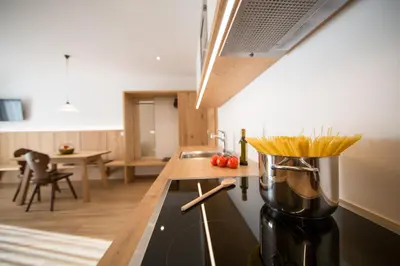 a kitchen with a counter with a pot on a stove at Residence Grünwald in San Martino