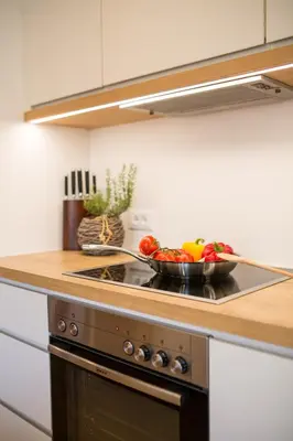 a bowl of vegetables on a stove in a kitchen at Residence Grünwald in San Martino