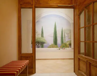 a room with a window with a picture of trees at Appartements Steiner in Valdaora
