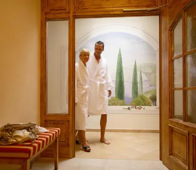 a man and a woman standing in a doorway at Appartements Steiner in Valdaora