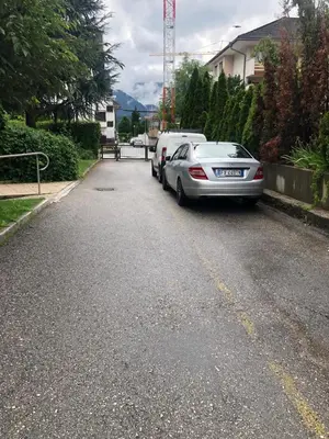 a car parked on the side of a street at Brunico 20 in Brunico