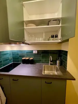 a kitchen with a sink and a counter top at Brunico 20 in Brunico