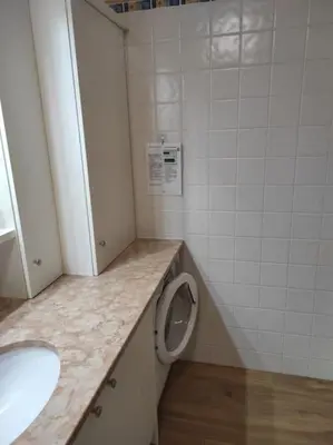 a bathroom with a toilet and a sink at Appartamento dles Dolomites in Corvara in Badia