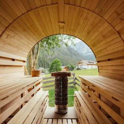 an inside view of a wooden sauna with an archway at Ostí Vedl in San Martino in Badia