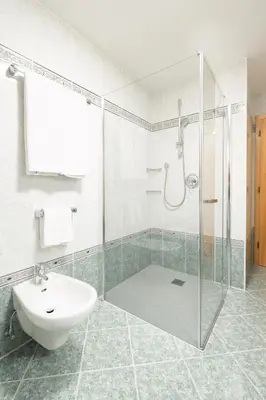 a bathroom with a shower and a sink and a toilet at Apartments Mauriz in Selva di Val Gardena