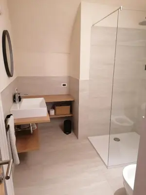 a bathroom with a sink and a shower at Fruemess - Historic Refugium in Parcines