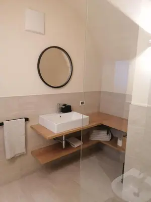 a bathroom with a sink and a mirror at Fruemess - Historic Refugium in Parcines