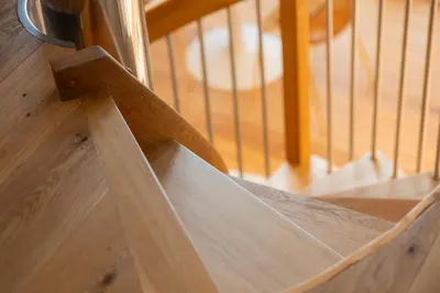 a close up of a wooden stair railing at KARINA Mulino in Montagna