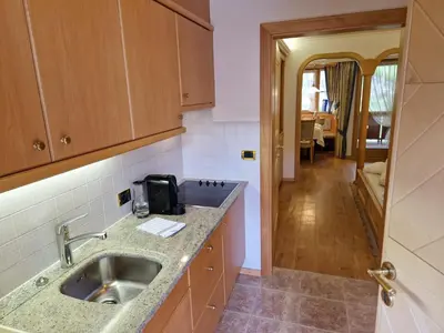 a kitchen with a sink and a counter top at Residence Ciastel in Ortisei