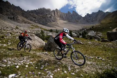two people riding bikes on a mountain trail at Hotel Gasthof Wieser in Petersberg