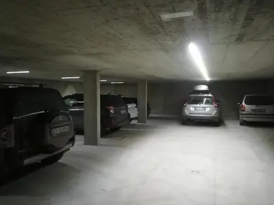 a parking garage with several cars parked in it at Ciasa Lisüra in Badia