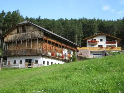 a house on the side of a hill at Polzhof in Castelrotto