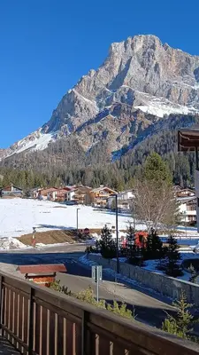 a view of a mountain with a snow covered mountain at Appartamento con terrazza vista Pale di San Martino in San Martino di Castrozza
