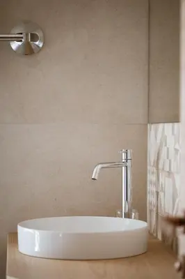 a bathroom with a white tub and a sink at Weingut Pardellerhof in Marlengo