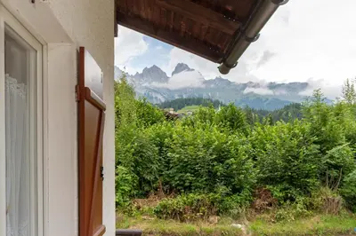 a window of a house with a view of a mountain at Villa Elisena in Falcade