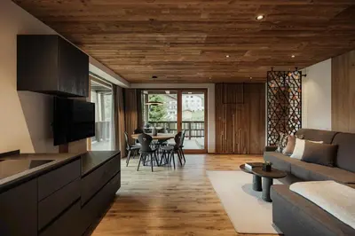 a living room with a couch and a table at Apartments Villa Sofia in Santa Cristina in Val Gardena