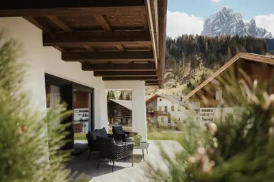 a house with a view of the mountains at Apartments Villa Sofia in Santa Cristina in Val Gardena