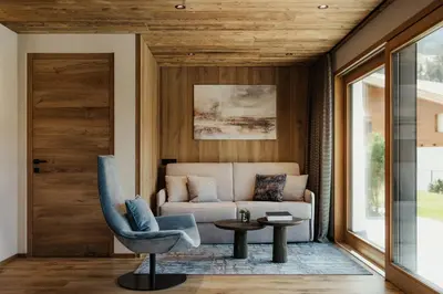 a living room with a couch and a table at Apartments Villa Sofia in Santa Cristina in Val Gardena