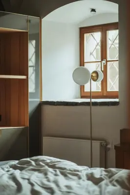 a bedroom with a bed and a window at Arthotel Lasserhaus in Bressanone