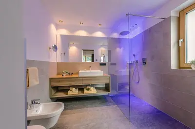 a bathroom with a sink and a shower at Alpwellhotel Burggräfler in Tesimo